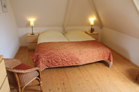 De slaapkamer met twee 1-persoonsbedden